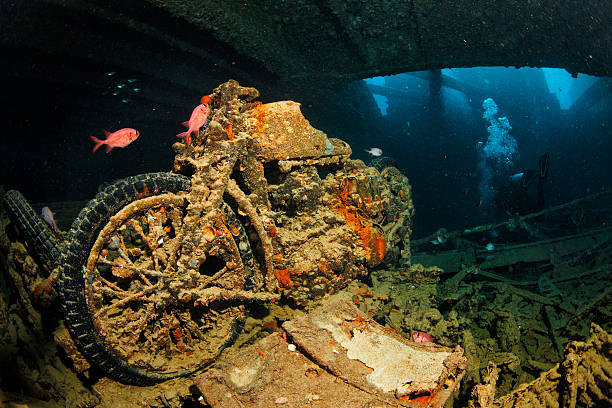 Underwater. Wreck diving Thistlegorm. BSA M20 motorcycle was part of a shipment of military equipment on its way to aid the Allies during World War II. The SS Thistlegorm was a British armed Merchant Navy ship built in 1940 by Joseph Thompson & Son in Sunderland, England. She was sunk on 6 October 1941 near Ras Muhammad in the Red Sea and is now a well known diving site.